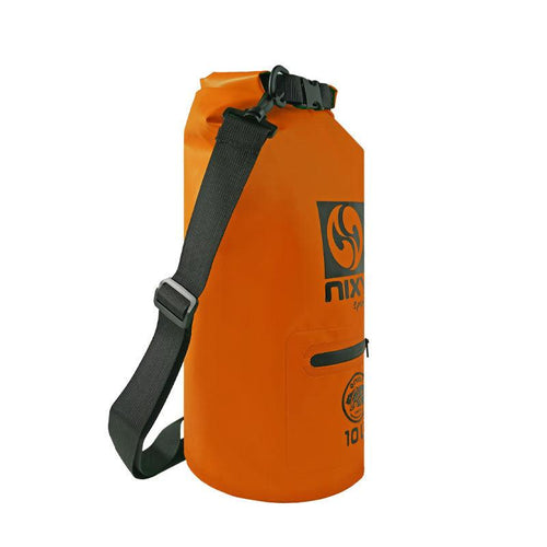 NIXY 10L Waterproof Dry Bag in Orange, side view showing roll top closure, adjustable shoulder strap and tapered silhouette, lightweight floating dry bag for paddleboarding, SUP, kayaking and beach adventures