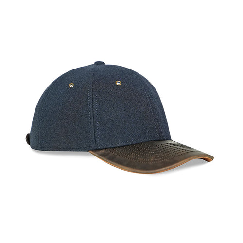 NIXY Chill Wool and Leather Performance Cap in Midnight Navy with brown leather brim, side product view of premium wool strapback hat with adjustable leather strap and moisture-absorbent sweatband